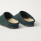 Close up of the heel of The Casual Clog in ReVelvet™ Pine, with Rothy's signature blue halo. 