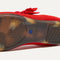 The sole of The Kids Tux Bow Mary Jane in Bright Red.