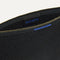 The Convertible Clutch in Black Espresso Open-Knit, shown open from the top in diagonal view.
