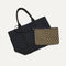 hover | Overlay::Clips onto The Lightweight Tote key leash. | Alt::Actual alt text The Convertible Clutch in Toffee Chevron, focusing on the strap.