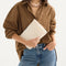 hover | Model shown holding the Convertible Clutch in Love Bird Open Knit.