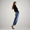 Alternate view of a model wearing The Daily Flat in Sable Spot. 