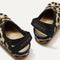 The back heel of The Kids Clog in Desert Cat showing the hook and loop straps.