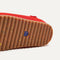 The sole of The Kids Clog in Firetruck Red.