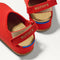 Close up of the back heel strap of The Kids Clog in Firetruck Red. 