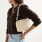 hover | Overlay:: Shown with The Camera Bag (sold separately) | Alt:: Model shown carrying The Shoulder Strap in Opal White Chain.