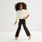 Alternate view of a model wearing The Kids Big Bow Mary Jane in Conch.