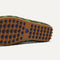 Close up of the supportive peg outsoles of The Men's Daily Driver in Forest Camo. 