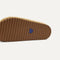 Close up of the heel of The Casual Clog in Metallic Golden Crochet, with Rothy's signature blue halo. 