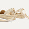 Close up of the heel of The D'Orsay Espadrille in Seashell, showing removable ankle straps.