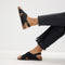 hover | Model wearing The Weekend Sandal in Black. 