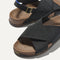 Close up of the crossing knit straps and toe of The Weekend Sandal in Black.