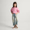 Alternate view of a model wearing The Kids MJ Sneaker in Desert Cat.