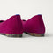 Close up of the heel of The Max Square Ballerina in ReVelvet Mulberry with Rothy's signature blue halo.