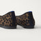 Close up of the heel of The Max Square Ballerina in ReVelvet Spotted Cat with Rothy's signature blue halo.