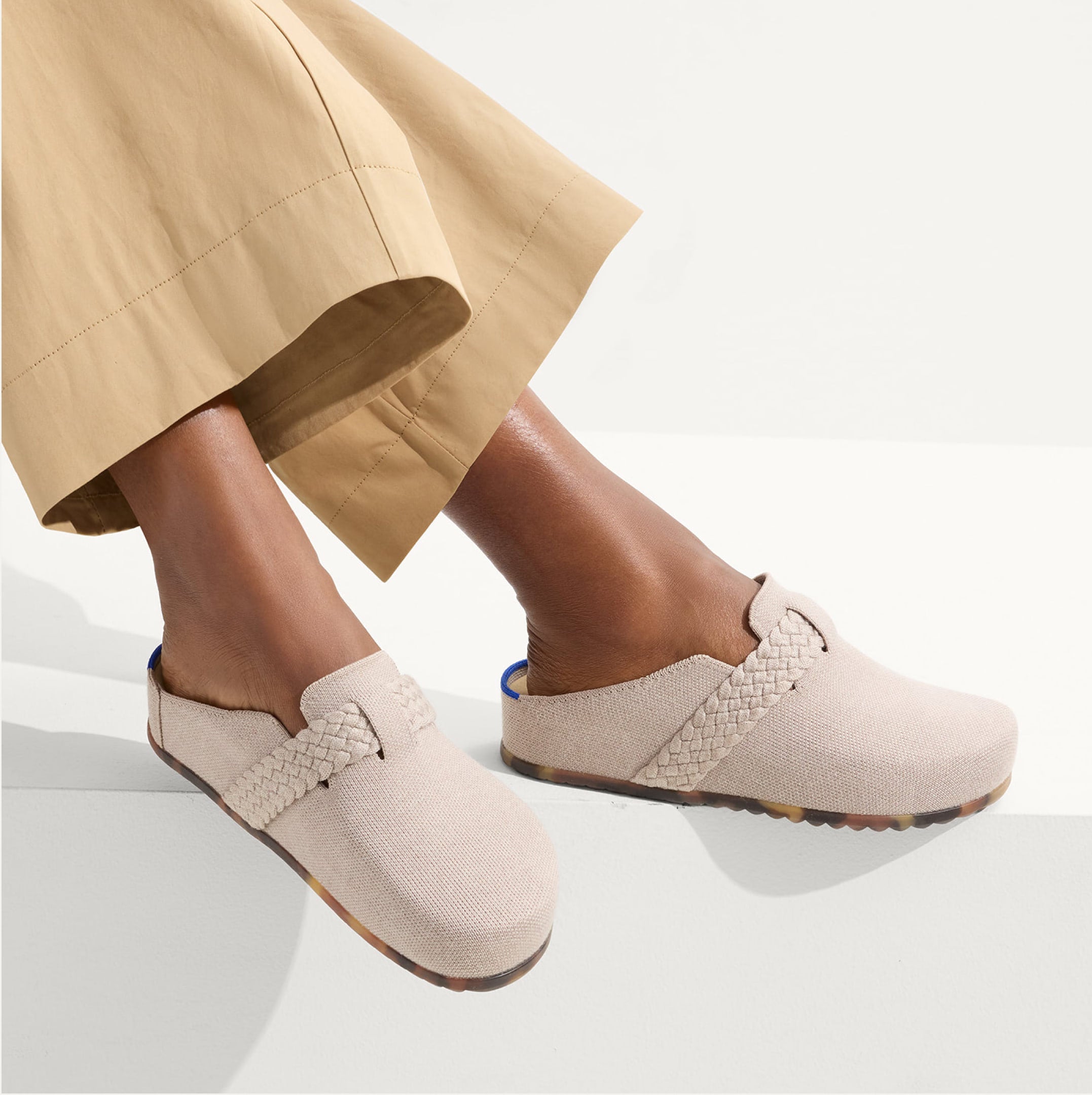 A model wearing The Braid Clog.