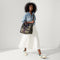 hover | Overlay:: Shown with The Crossbody Strap (sold separately.) | Alt:: The Classic Tote in Spruce Camo, worn as a crossbody by a model paired with The Crossbody Strap in Spruce Camo. 