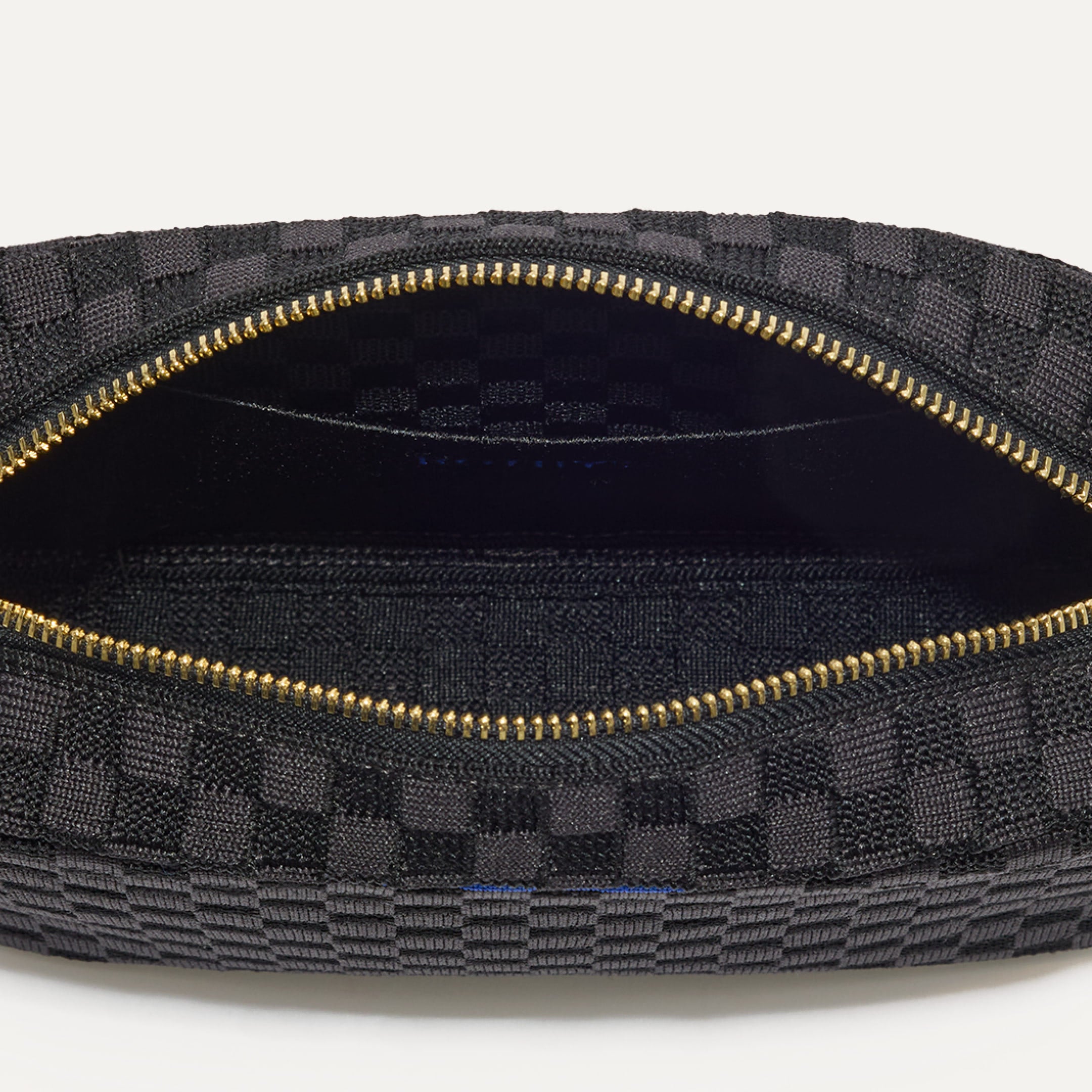 Interior close up of The Crossbody Camera Bag in Black Sand.