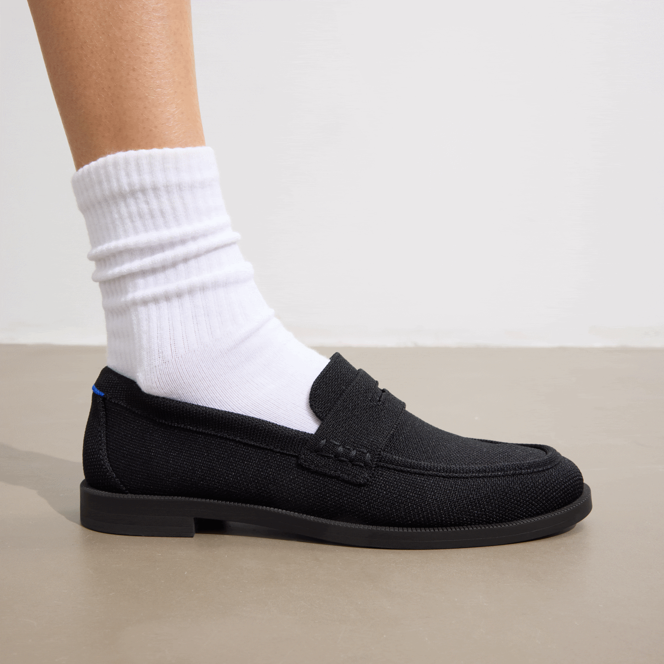 Close up shot of The Penny Loafer in Black. Classic loafer look with sleek lines and sustainable craftsmanship.
