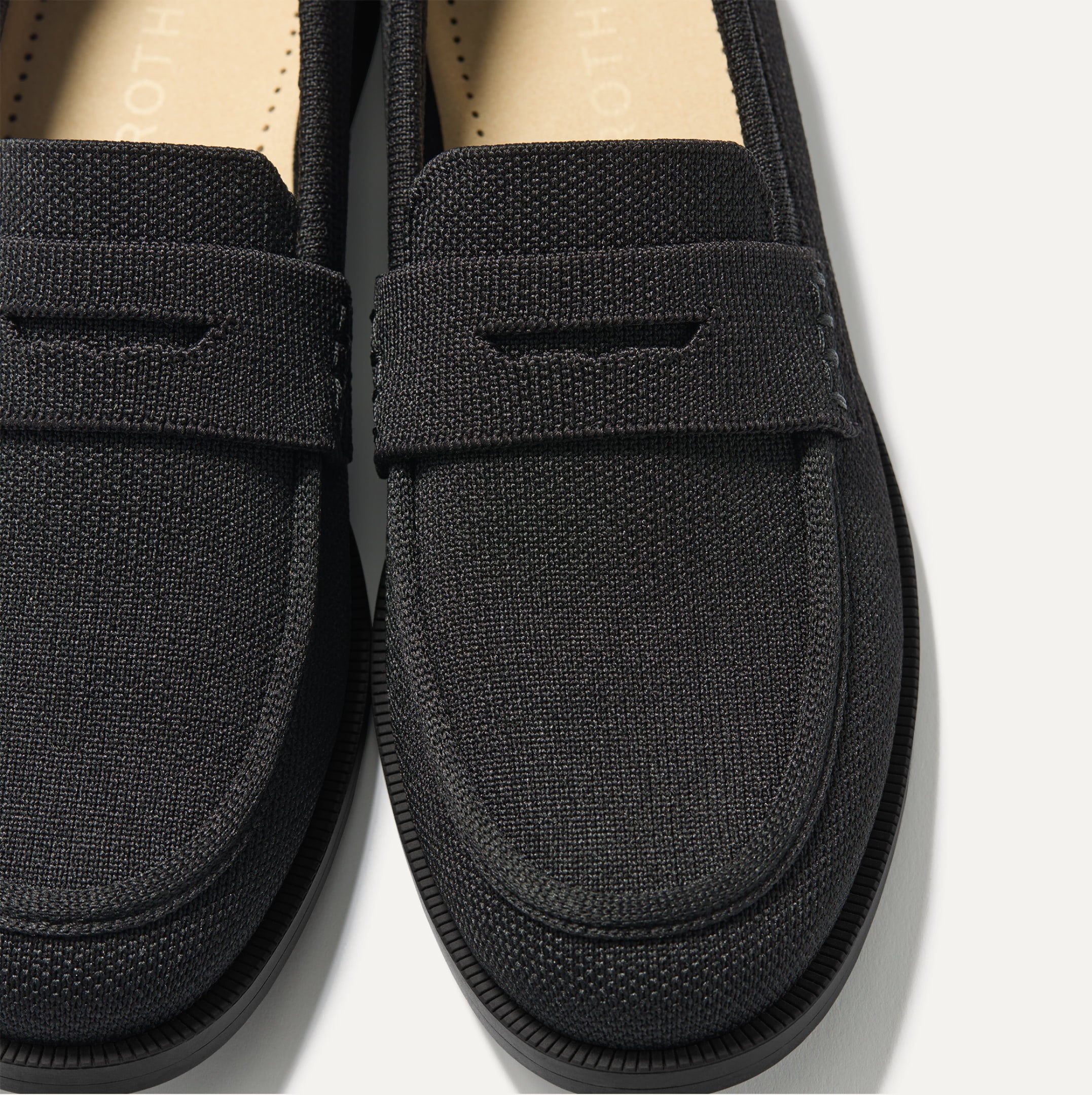 Close up shot of The Penny Loafer in Black. Classic loafer look with sleek lines and sustainable craftsmanship.