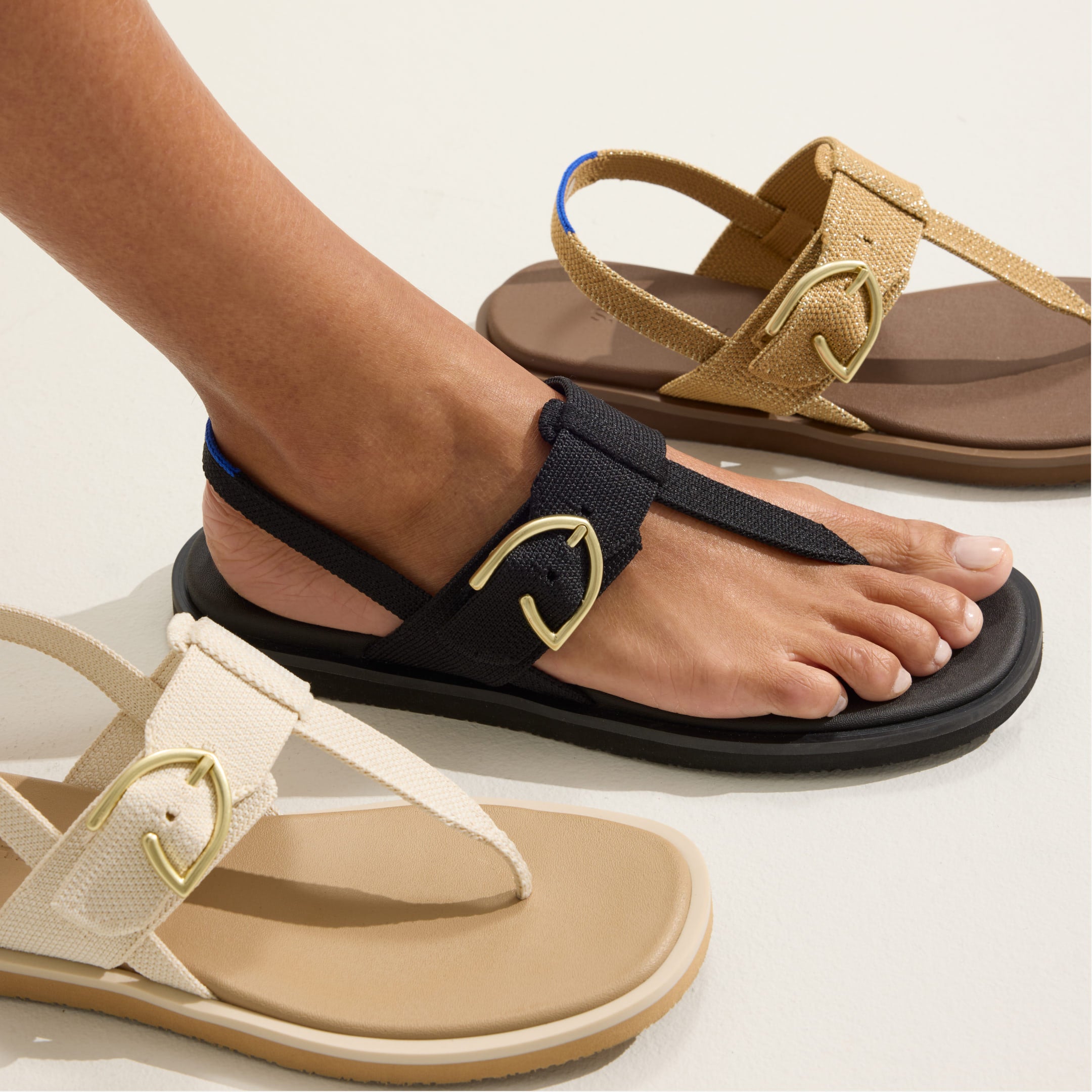 Model wearing The T-Strap Sandal.