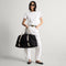 hover | Model holding The Travel Duffle Bag in Ink.