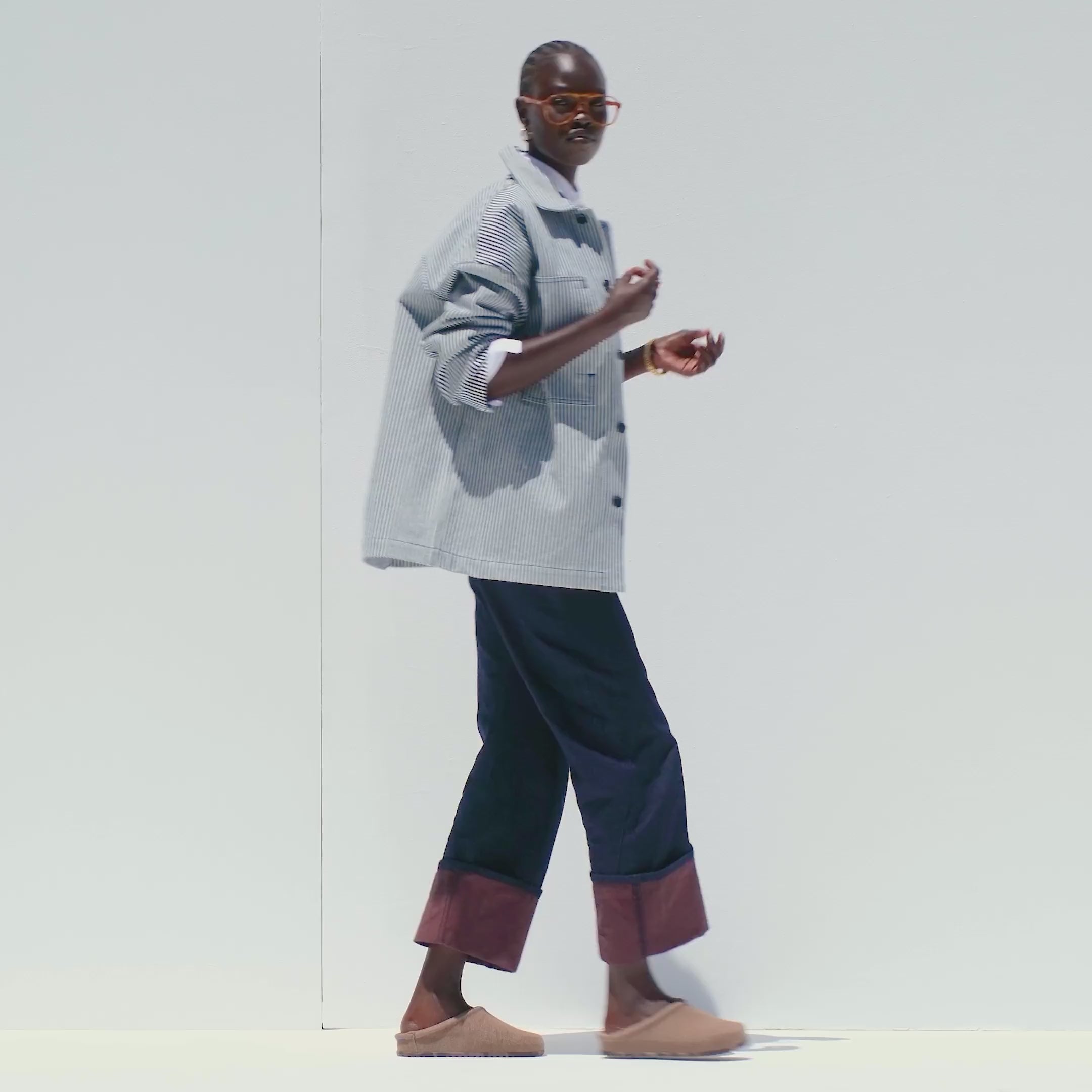 Model walking in The Casual Clog in ReVelvet Portobello and showing different angles of the shoes. 