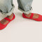 Model walking in The Kids Mary Jane in Glamour Red and showing different angles of the shoes. 